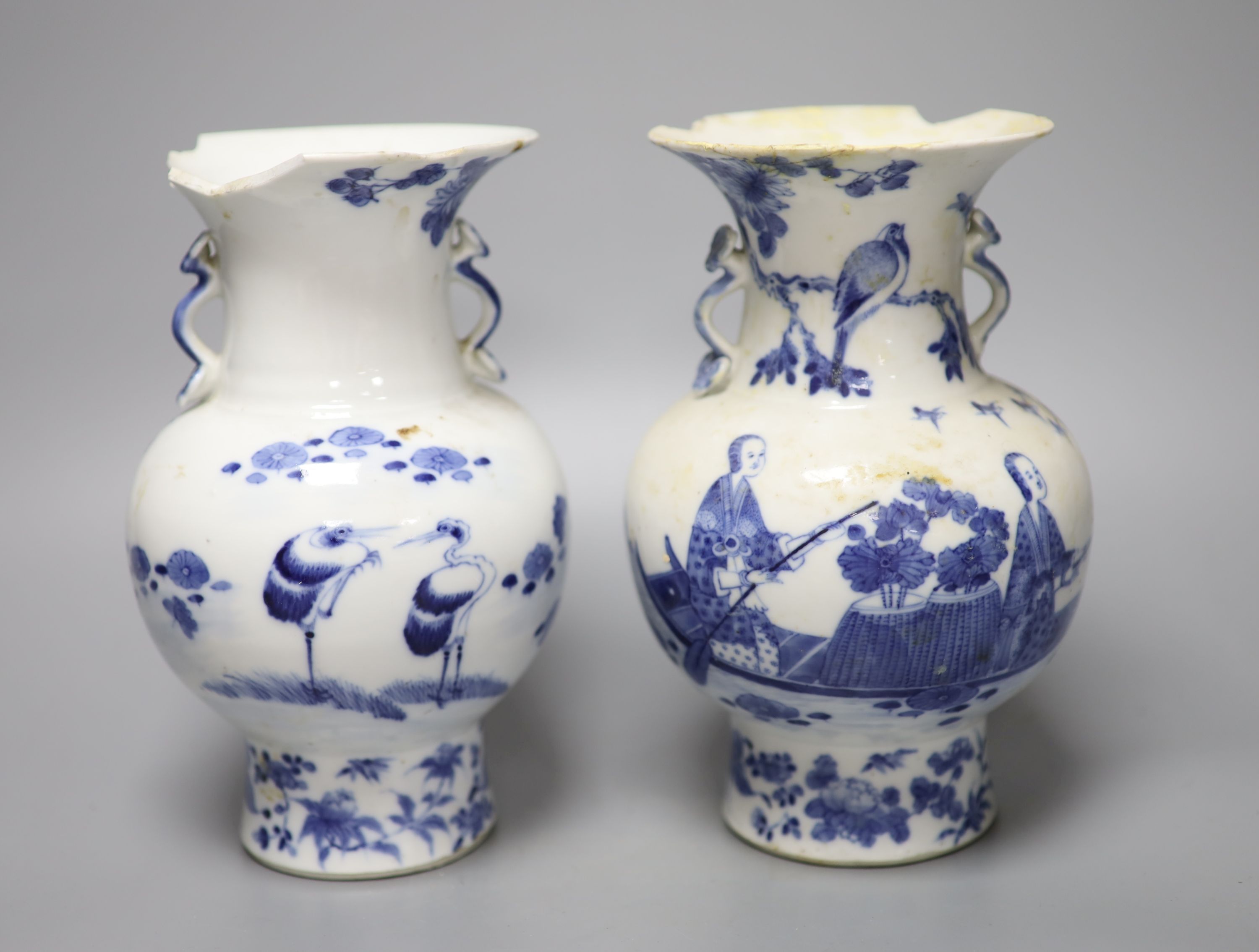 A pair of 19th century Chinese blue and white vases (a.f.), 23cm high